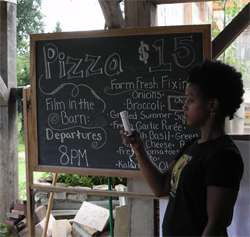 The chalkboard offering the options for Pizza night at DreamAcres.